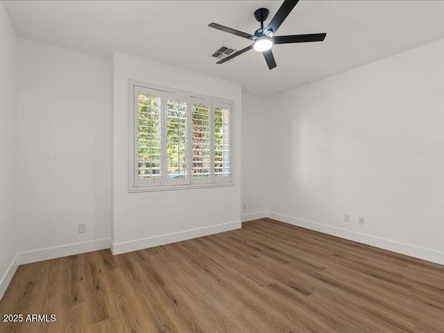 271 W Roadrunner Dr, Chandler, AZ 85286 - empty room with baseboards, ceiling fan, wood finished floors, and visible vents