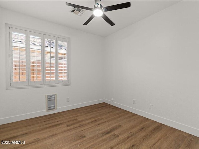 271 W Roadrunner Dr, Chandler, AZ 85286 - spare room with baseboards, ceiling fan, wood finished floors, and visible vents