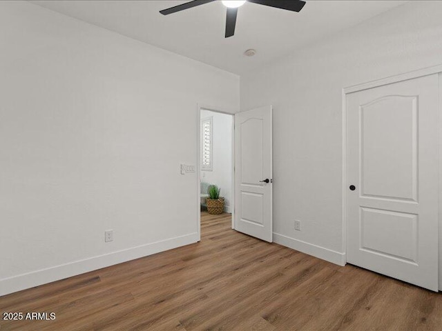271 W Roadrunner Dr, Chandler, AZ 85286 - unfurnished bedroom featuring a ceiling fan, baseboards, and wood finished floors
