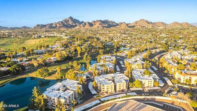 drone / aerial view with a water and mountain view