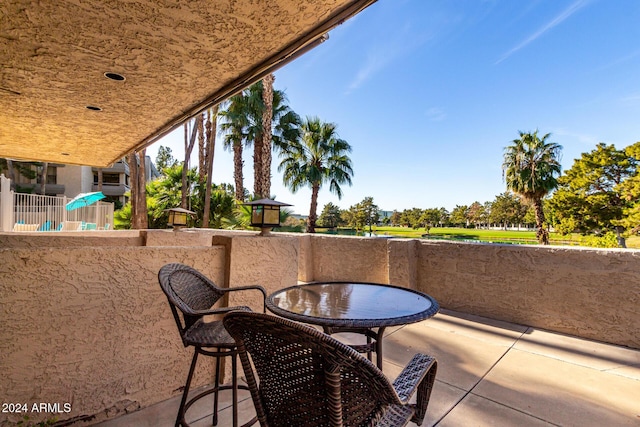 view of patio with a balcony