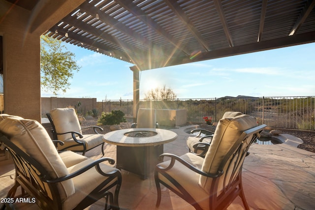 view of patio featuring a fenced backyard, a fire pit, and a pergola