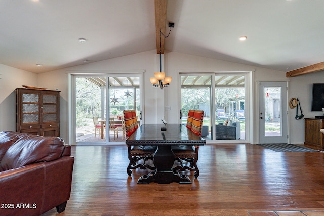 dining room featuring vaulted ceiling with beams, wood finished floors, and a notable chandelier