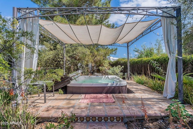 view of patio / terrace featuring hot tub deck surround