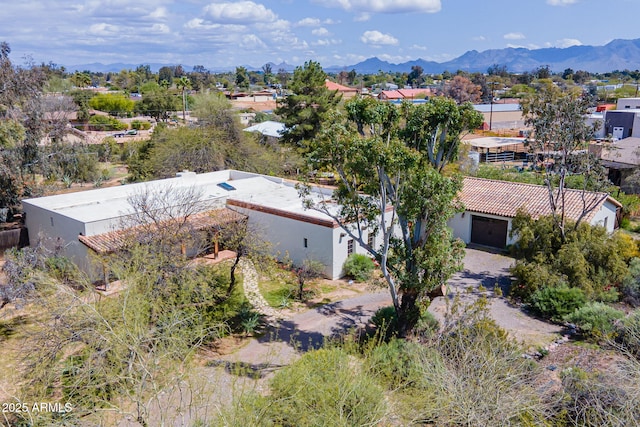 drone / aerial view featuring a mountain view