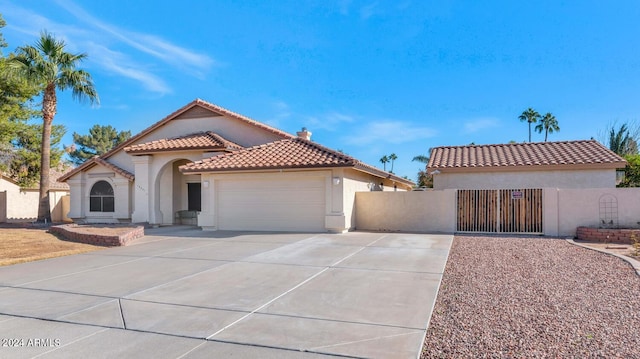 mediterranean / spanish-style home featuring a garage