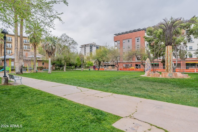 view of home's community featuring a lawn