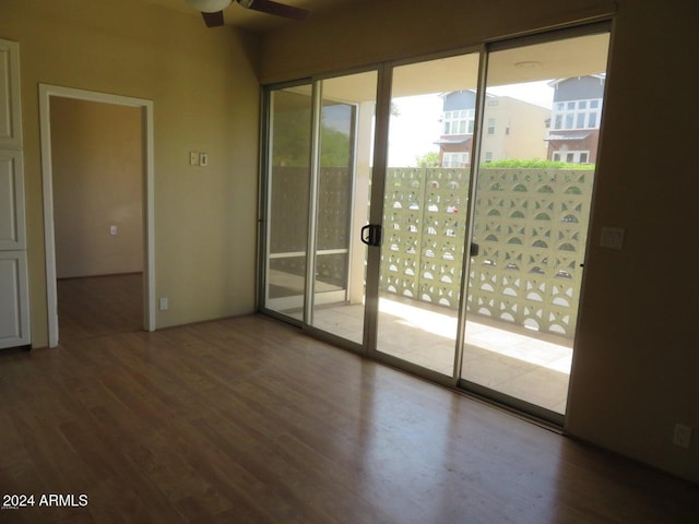 spare room featuring hardwood / wood-style floors and ceiling fan