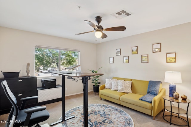 office area with light colored carpet and ceiling fan