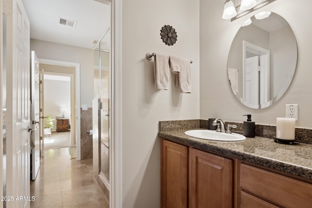 bathroom featuring vanity and walk in shower