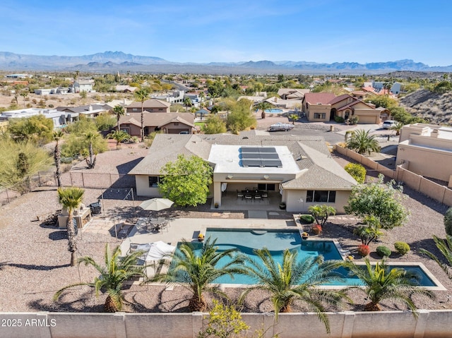 birds eye view of property featuring a mountain view