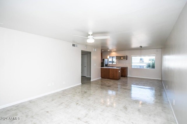 1630 E Georgia Ave Unit 208, Phoenix, AZ 85016 - unfurnished living room with finished concrete floors and ceiling fan