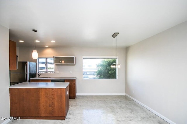 1630 E Georgia Ave Unit 208, Phoenix, AZ 85016 - kitchen with freestanding refrigerator, light countertops, brown cabinetry, concrete floors, and dishwashing machine