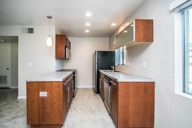 1630 E Georgia Ave Unit 208, Phoenix, AZ 85016 - kitchen with stainless steel appliances, plenty of natural light, brown cabinets, and recessed lighting