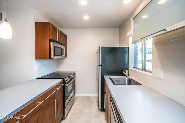 1630 E Georgia Ave Unit 208, Phoenix, AZ 85016 - kitchen featuring appliances with stainless steel finishes, recessed lighting, light countertops, decorative light fixtures, and brown cabinets