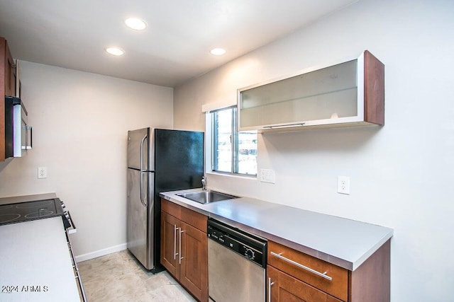 1630 E Georgia Ave Unit 208, Phoenix, AZ 85016 - kitchen featuring appliances with stainless steel finishes, recessed lighting, brown cabinetry, and light countertops