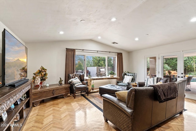 living room featuring french doors, light parquet floors, and vaulted ceiling