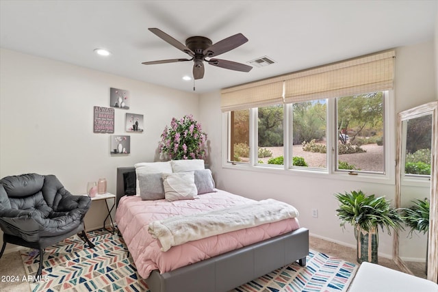 carpeted bedroom featuring ceiling fan