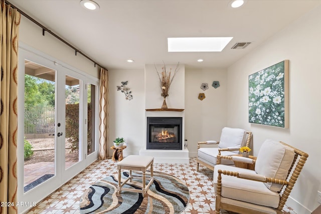 sitting room with french doors and a skylight