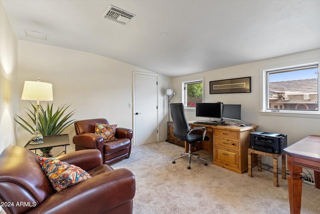 office area with light carpet and lofted ceiling