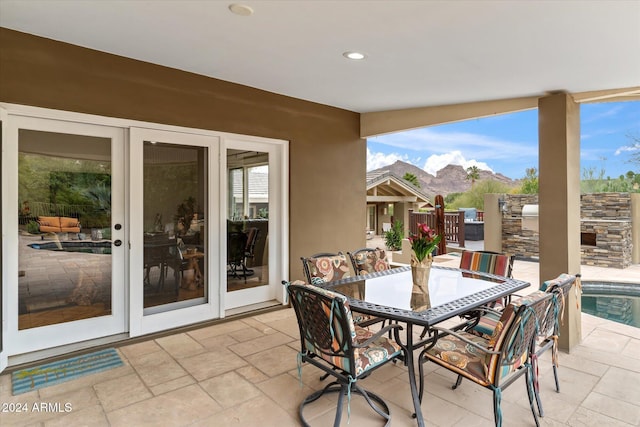 view of patio with a mountain view and a fenced in pool