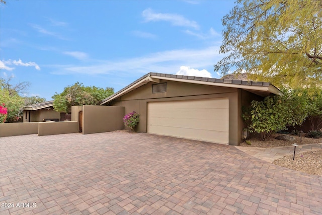 view of front of property featuring a garage