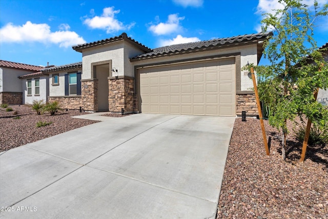 17140 W Running Deer Trl, Surprise, AZ 85387 - mediterranean / spanish house featuring stone siding, concrete driveway, stucco siding, a garage, and a tiled roof