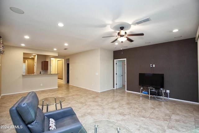 living room featuring ceiling fan