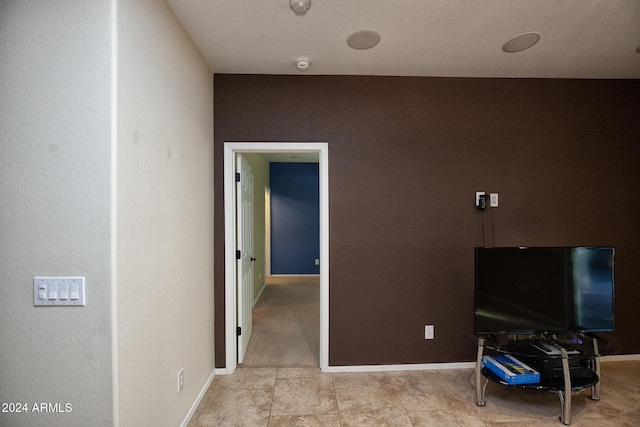 misc room with light tile patterned floors