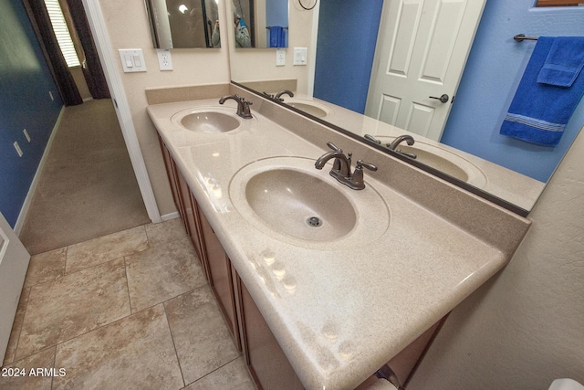 bathroom featuring tile patterned floors and vanity