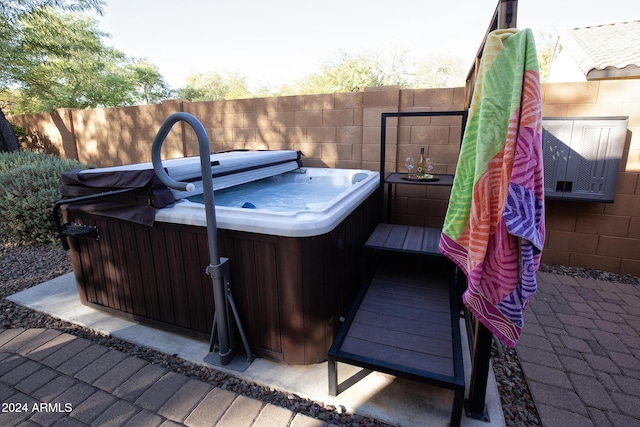 wooden terrace with a hot tub