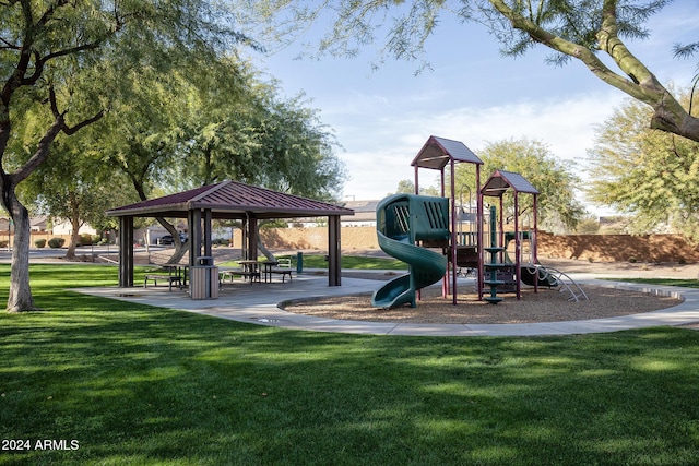 view of jungle gym featuring a lawn