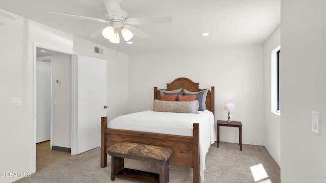 455 N Tegner St Unit 59, Wickenburg, AZ 85390 - bedroom with light colored carpet, a ceiling fan, and recessed lighting