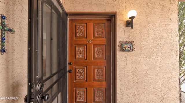 455 N Tegner St Unit 59, Wickenburg, AZ 85390 - view of exterior entry featuring stucco siding
