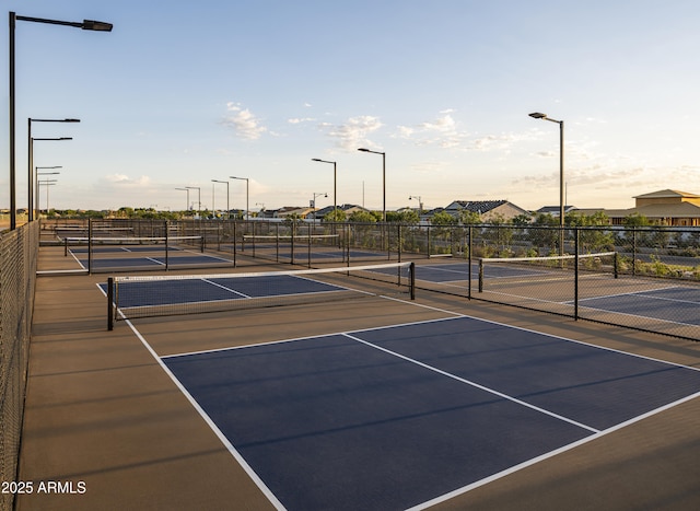 view of sport court with basketball hoop