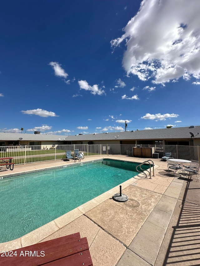 view of swimming pool with a patio area