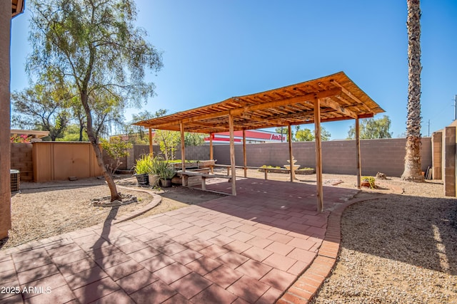 view of patio featuring a pergola, a shed, and central AC unit