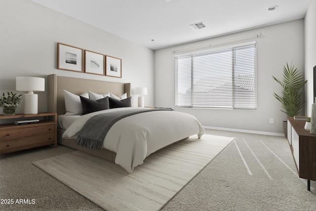 bedroom featuring light carpet