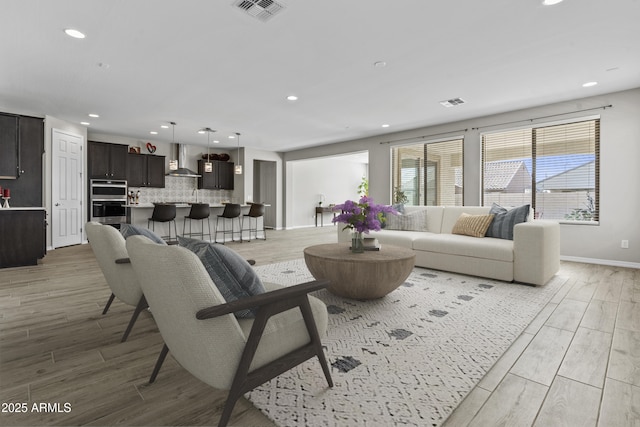 living room with light hardwood / wood-style flooring