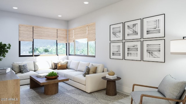 living area featuring baseboards and recessed lighting