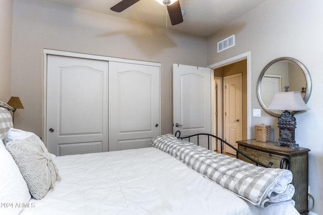 bedroom featuring ceiling fan and a closet