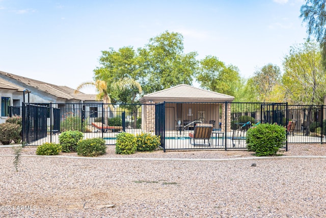 exterior space featuring a fenced in pool and a patio area