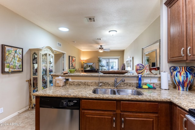 kitchen featuring sink, ceiling fan, kitchen peninsula, and appliances with stainless steel finishes