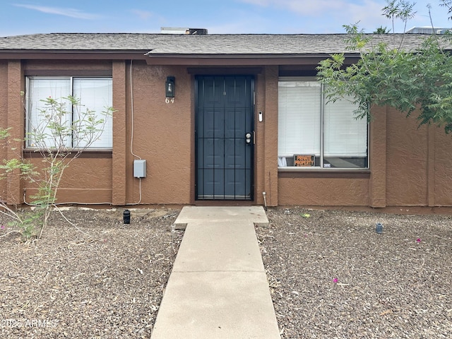 3646 N 67th Ave Unit 64, Phoenix, AZ 85033 - property entrance featuring stucco siding and a shingled roof