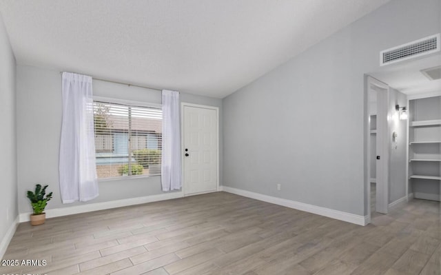 3646 N 67th Ave Unit 64, Phoenix, AZ 85033 - spare room with wood finished floors and baseboards