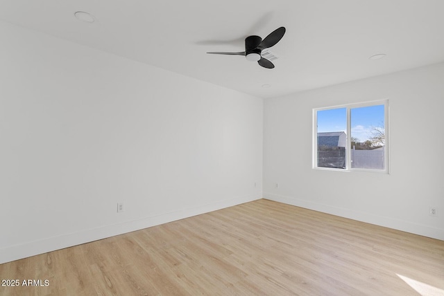 unfurnished room with ceiling fan and light hardwood / wood-style floors