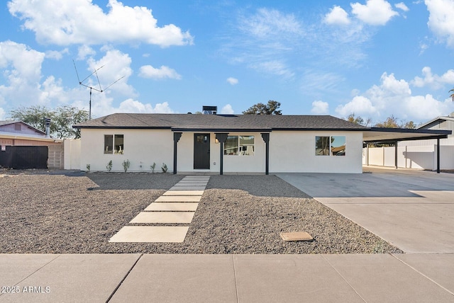 view of front of property with a carport