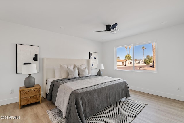 bedroom with ceiling fan and light wood-type flooring