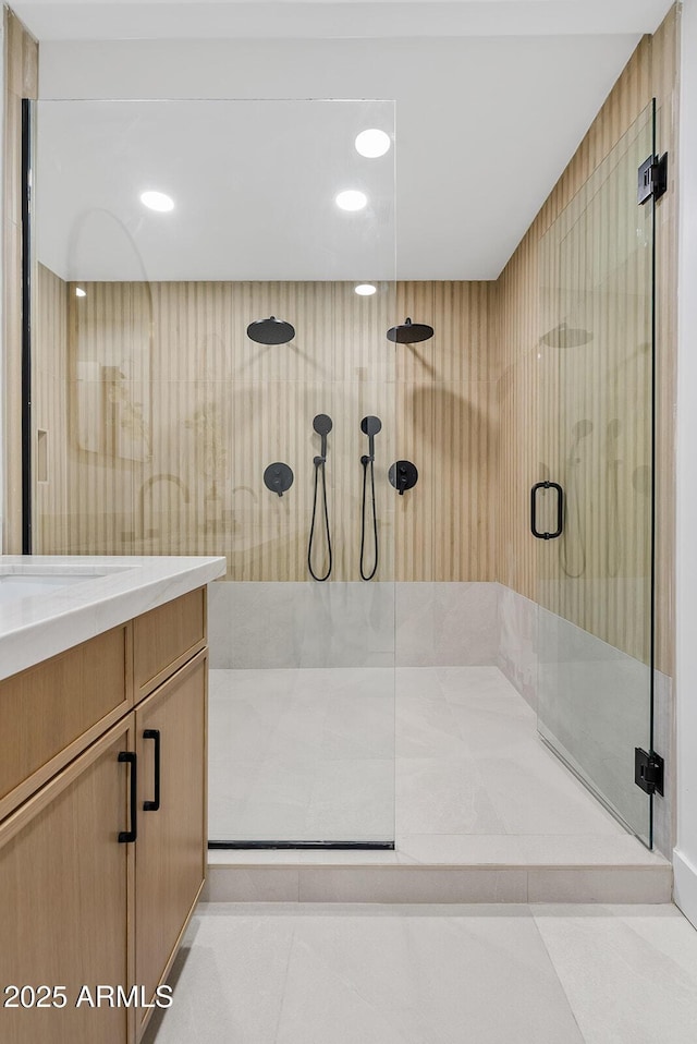 bathroom featuring tile patterned flooring and an enclosed shower