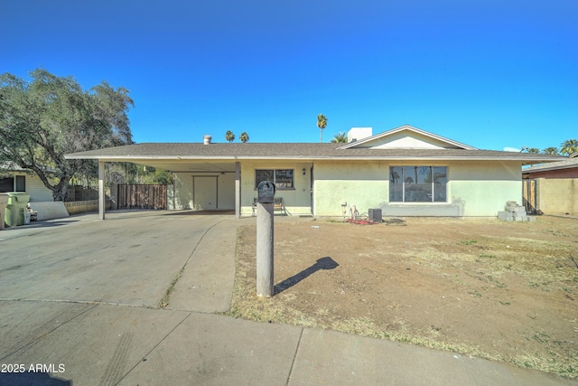 ranch-style house with a carport